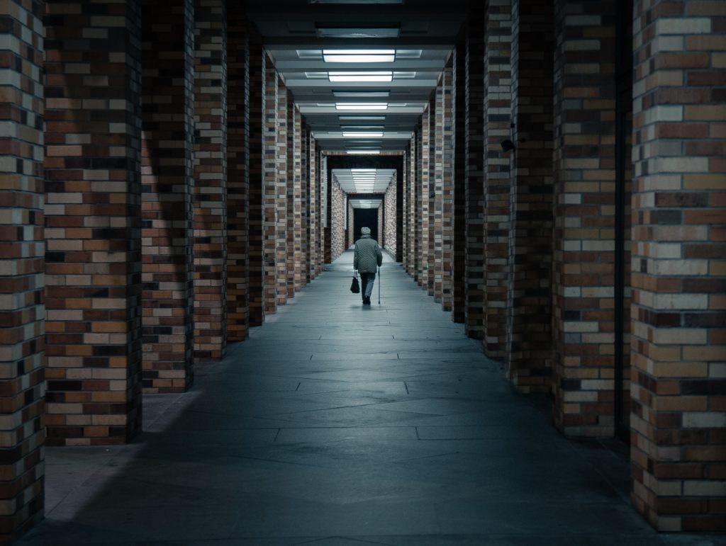 Men walking to end of hallway